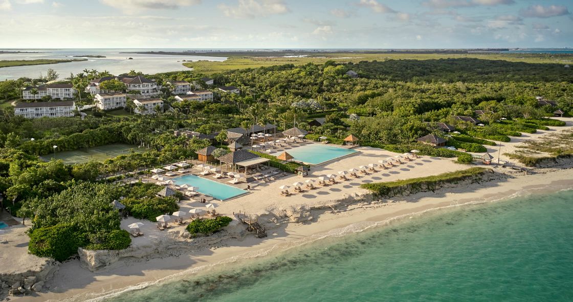 A Beach With Houses And Trees