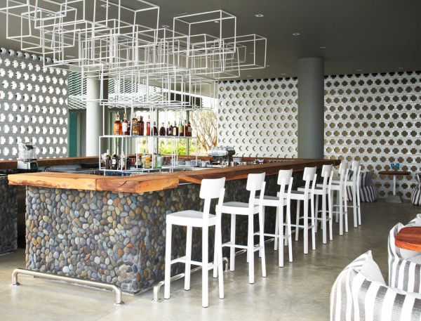 A Room With A Bar And Chairs