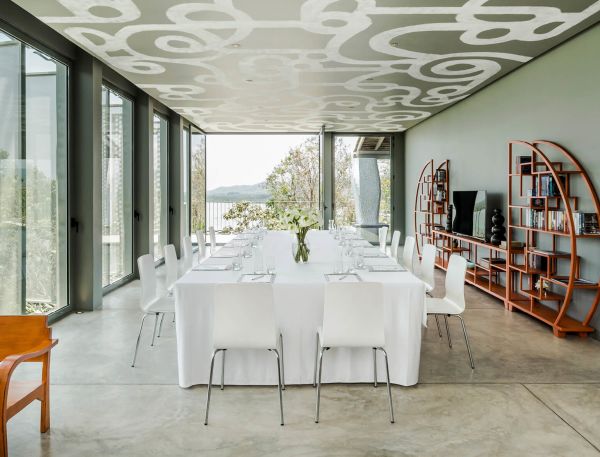 A Room With A Table And Chairs