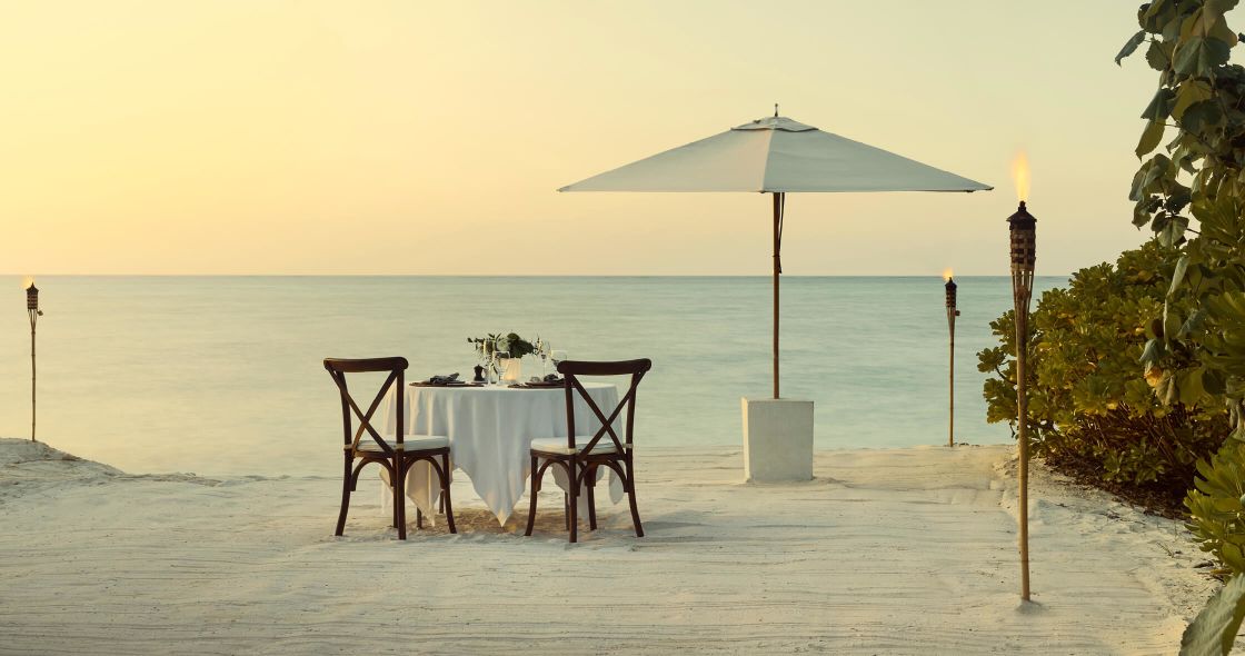A Table And Chairs On A Beach