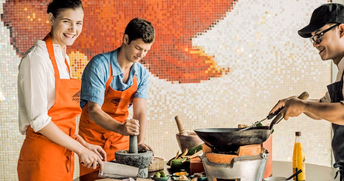 A Group Of Men Cooking