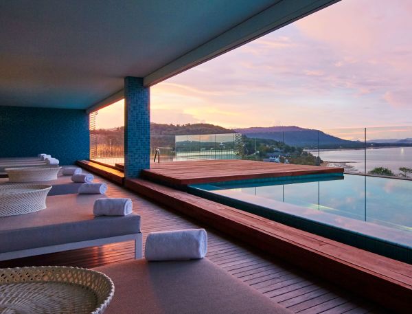 A Room With A Pool And Chairs