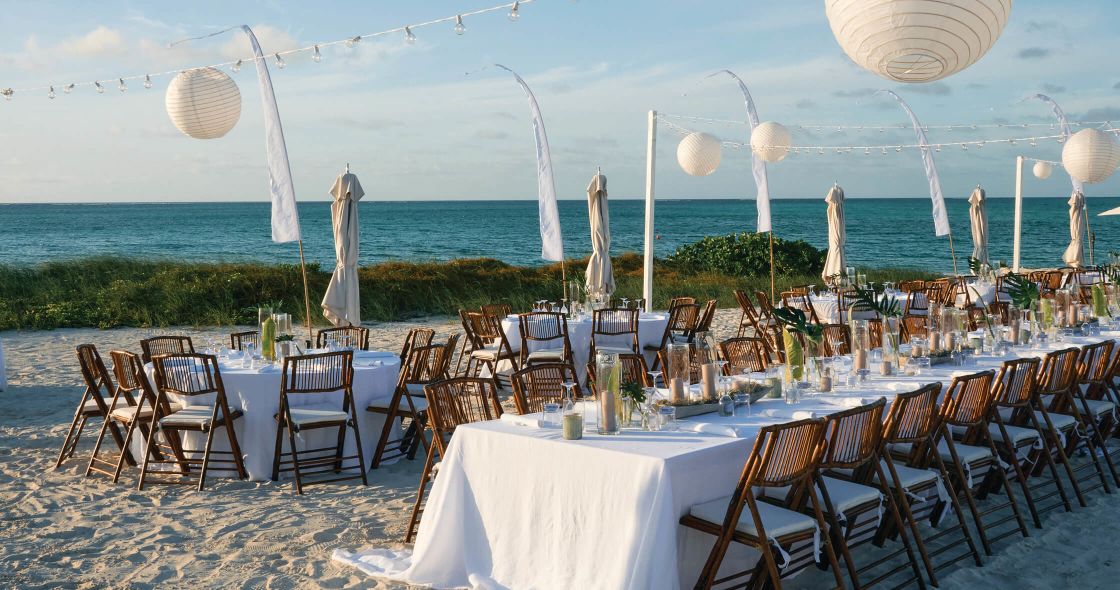 A Table Set For A Meal On A Beach