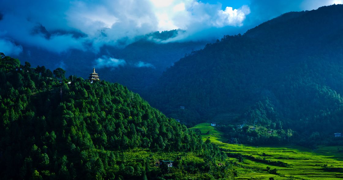 A Landscape With Trees And Mountains