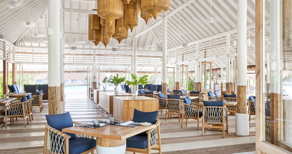 A Room With Tables And Chairs