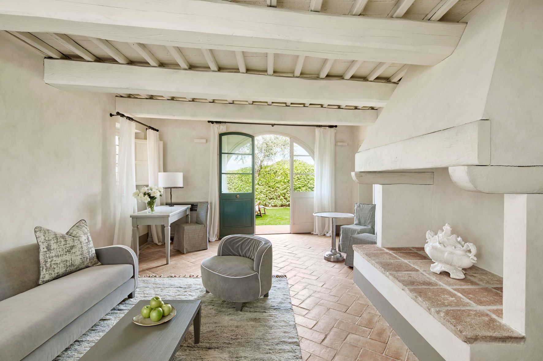 A Living Room With A Stone Patio