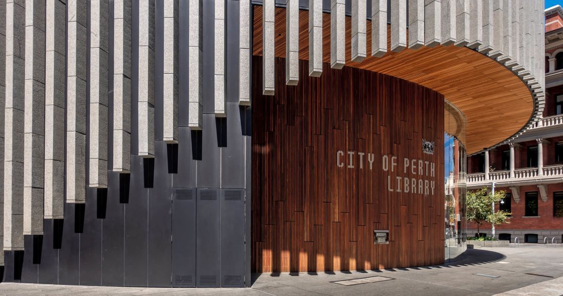 A Building With A Large Wooden Wall
