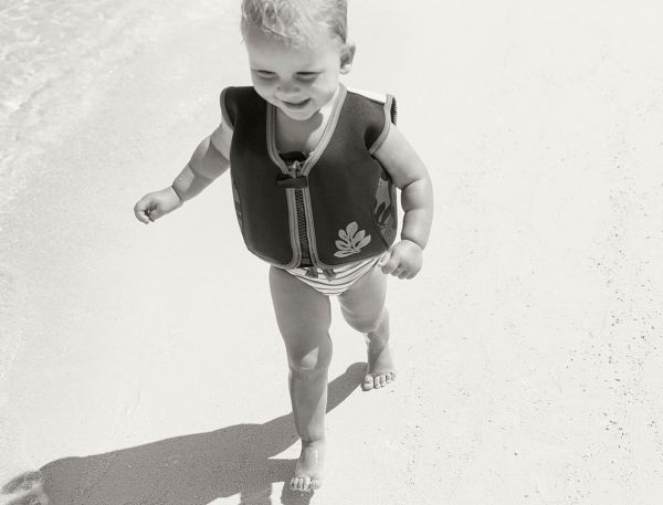 A Baby Running On Sand