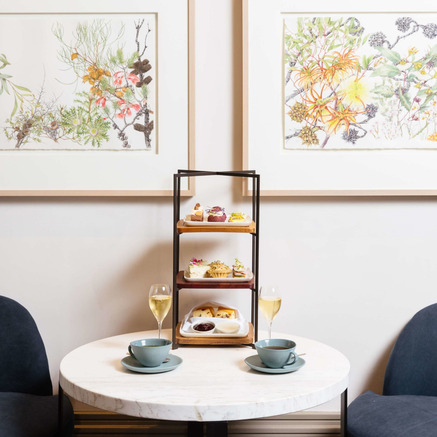 A Table With A Tray Of Food And Cups On It