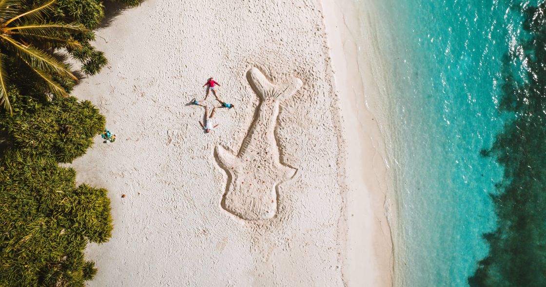 A Couple People On A Beach