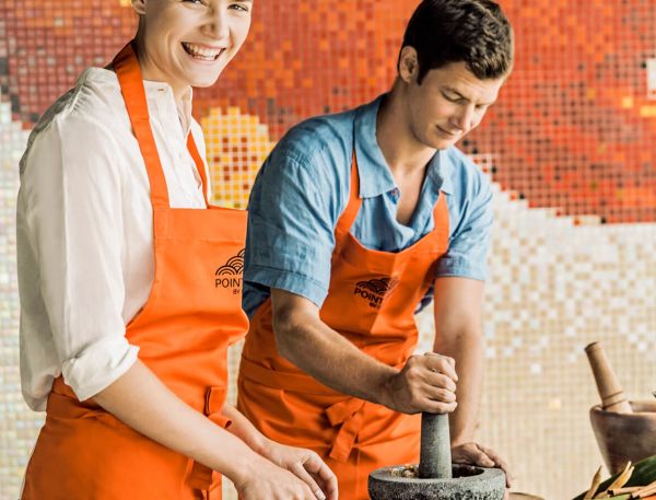 A Group Of Men Cooking
