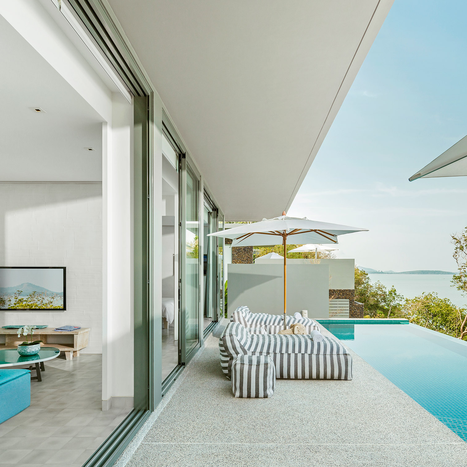 A Swimming Pool And Lounge Chairs