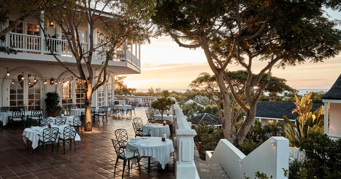 A Patio With Tables And Chairs
