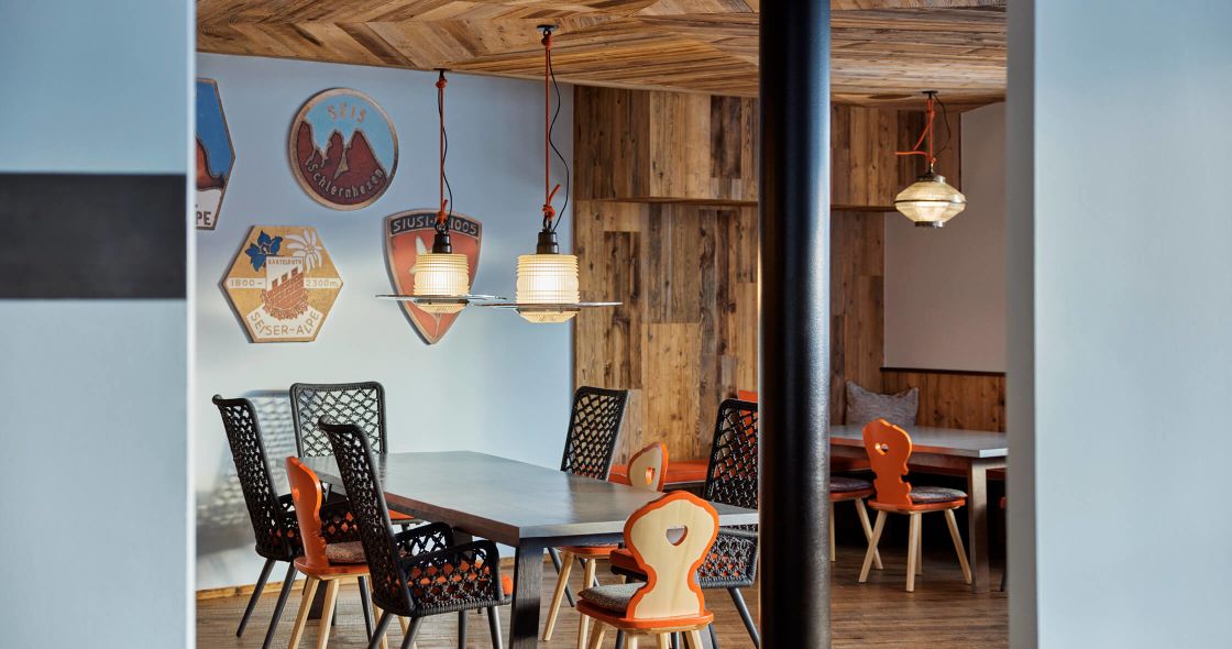 A Room With A Table And Chairs