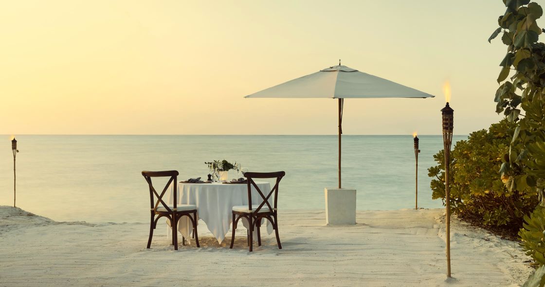 A Table And Chairs On A Beach