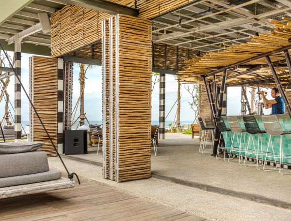 A Person Standing In A Room With A Large Metal Structure