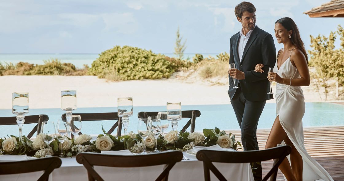 A Man And Woman Holding Wine Glasses