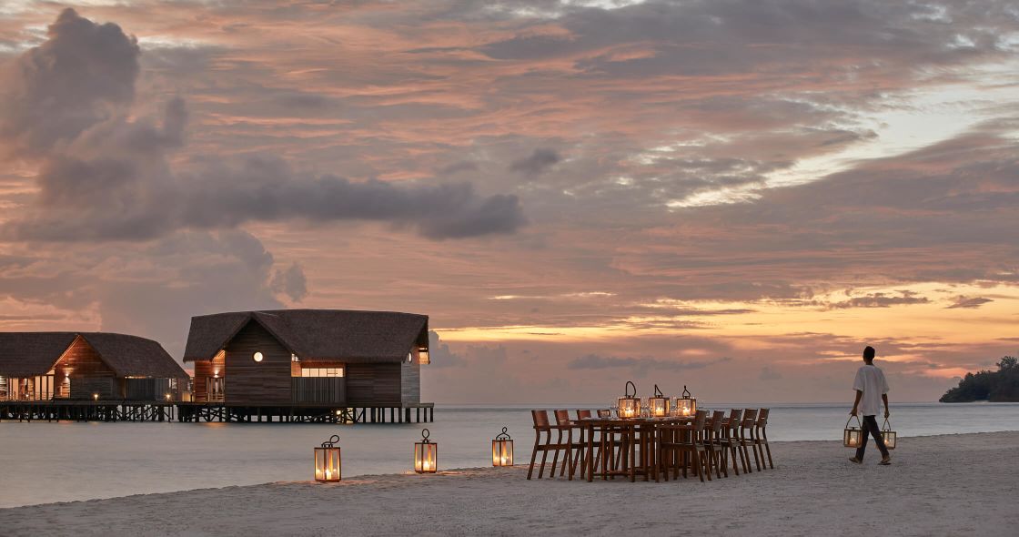 A Person Walking On A Beach