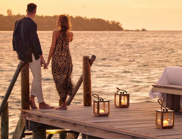 A Man And Woman On A Dock