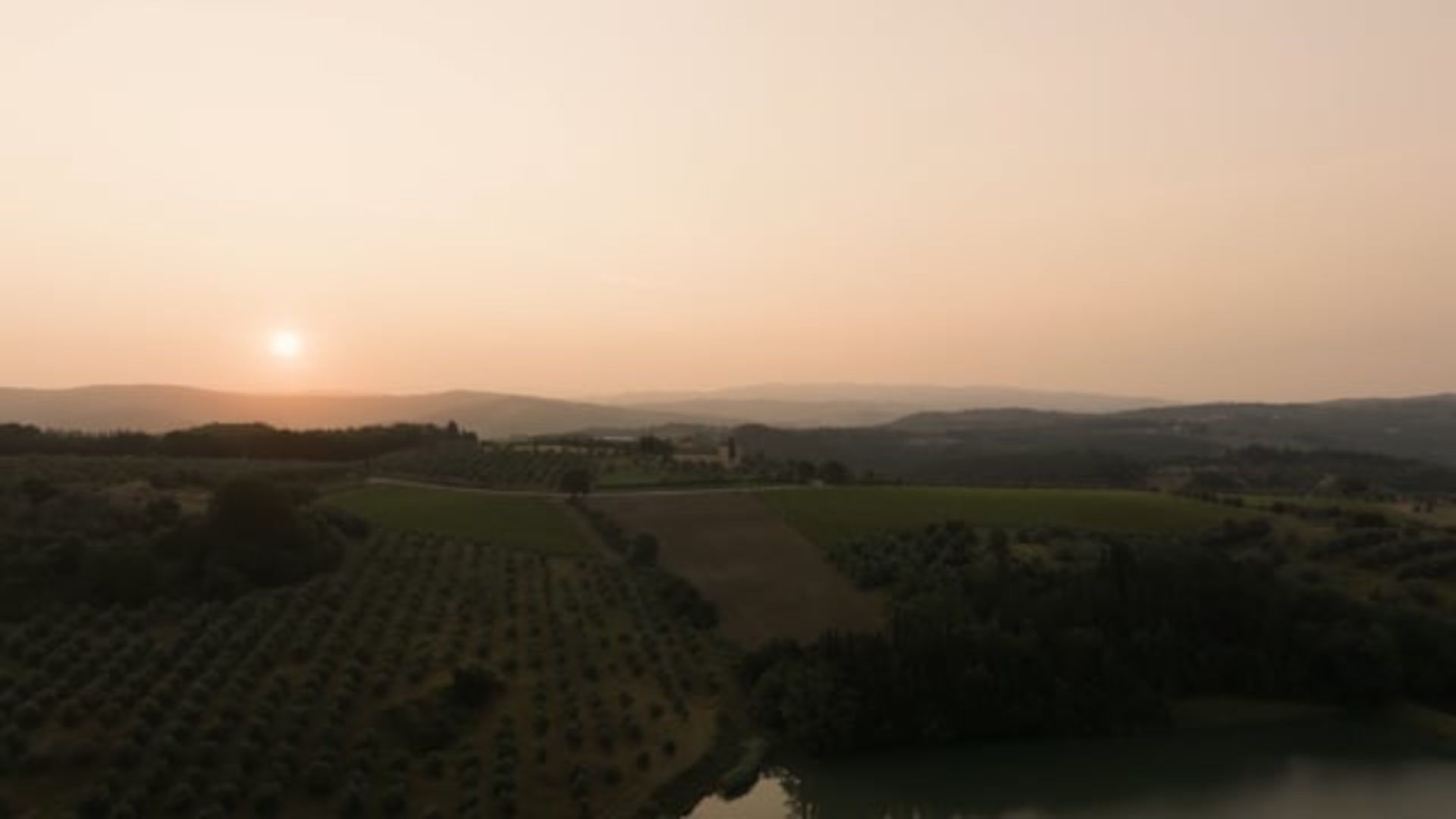 A Landscape With Trees And A Body Of Water In The Background