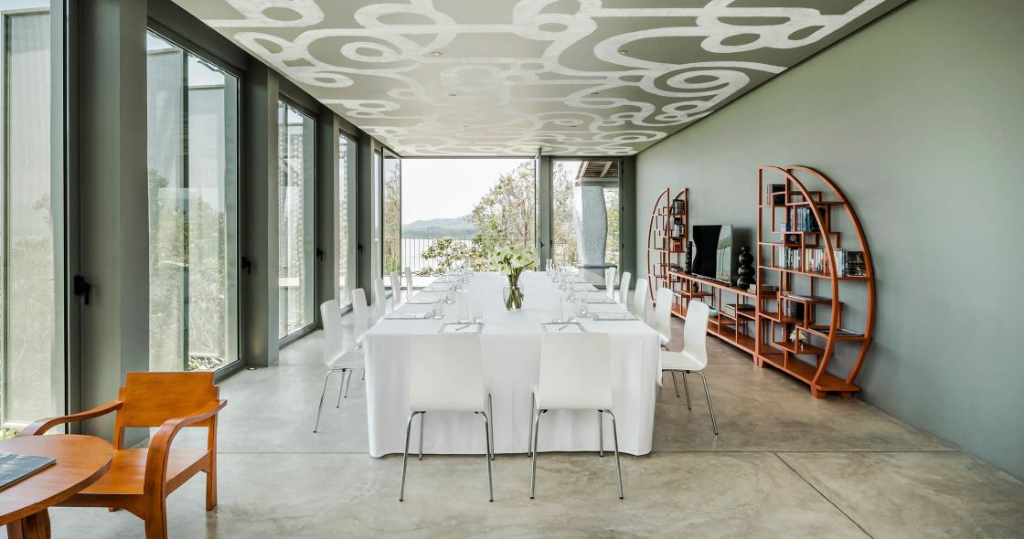 A Room With A Table And Chairs