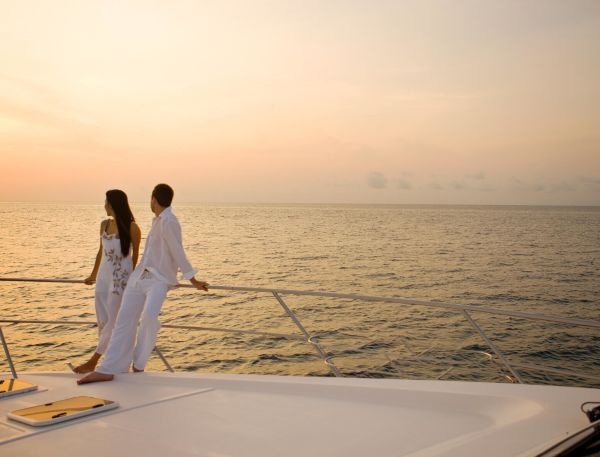 A Man And Woman Holding Hands On A Boat