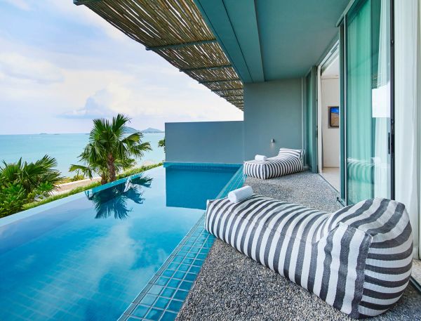 Infinity pool with sun loungers