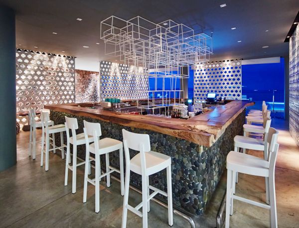 A Room With A Bar And Chairs