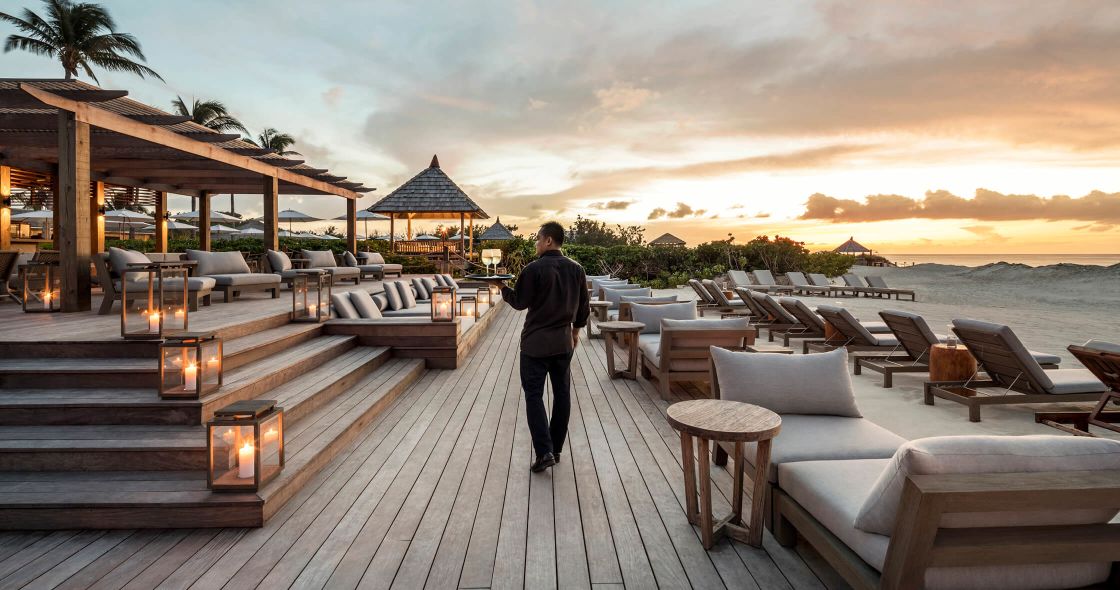 A Person Walking On A Boardwalk