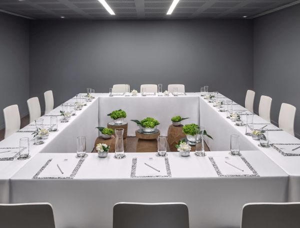 A Table With Chairs And Glasses On It