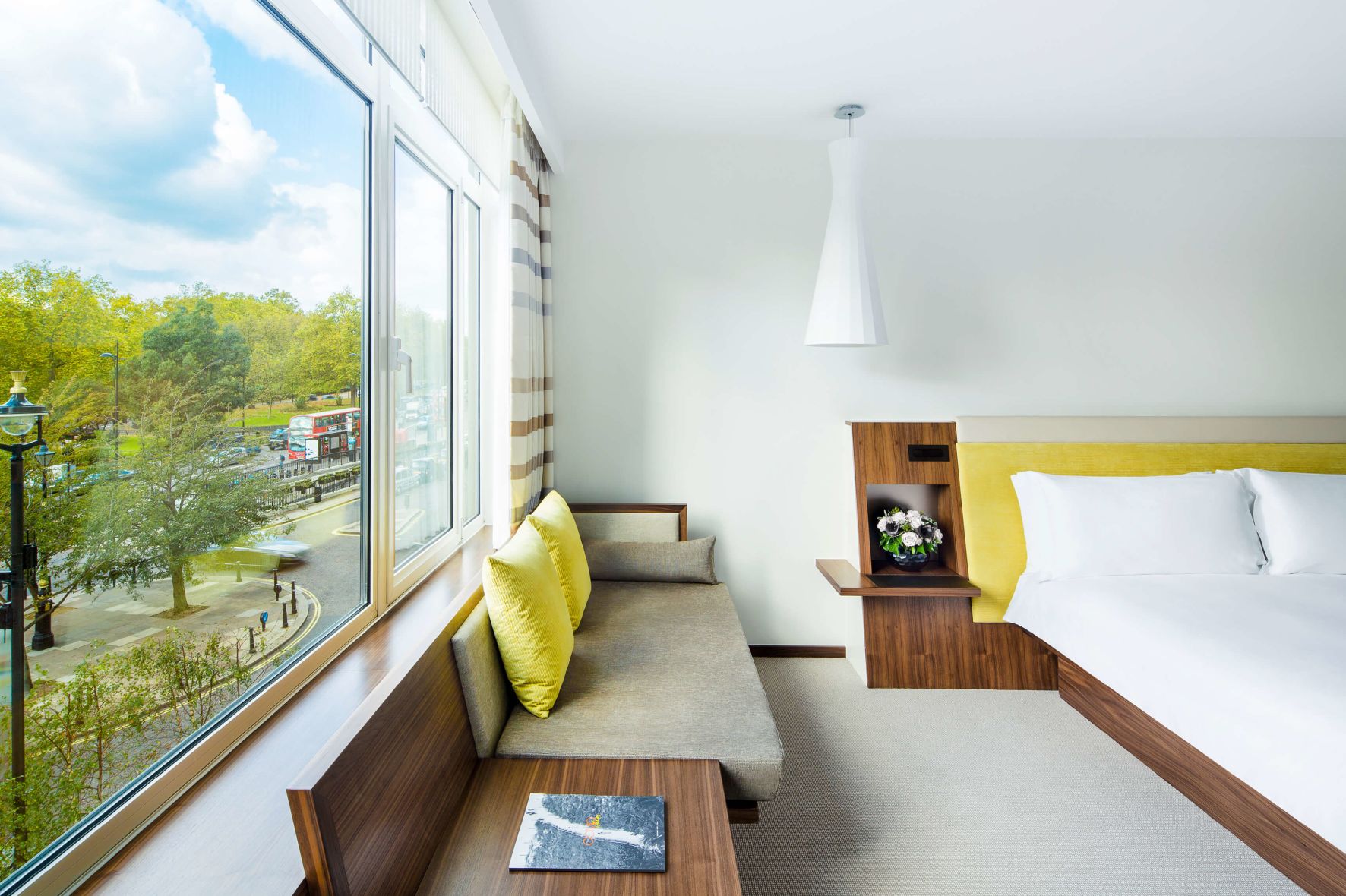 A Bedroom With A Large Window